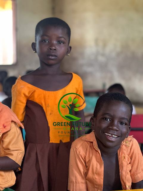 Two smiling children in a classroom
